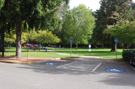 Accessible parking spaces near sports fields – curb-cut to paved access route to playground
